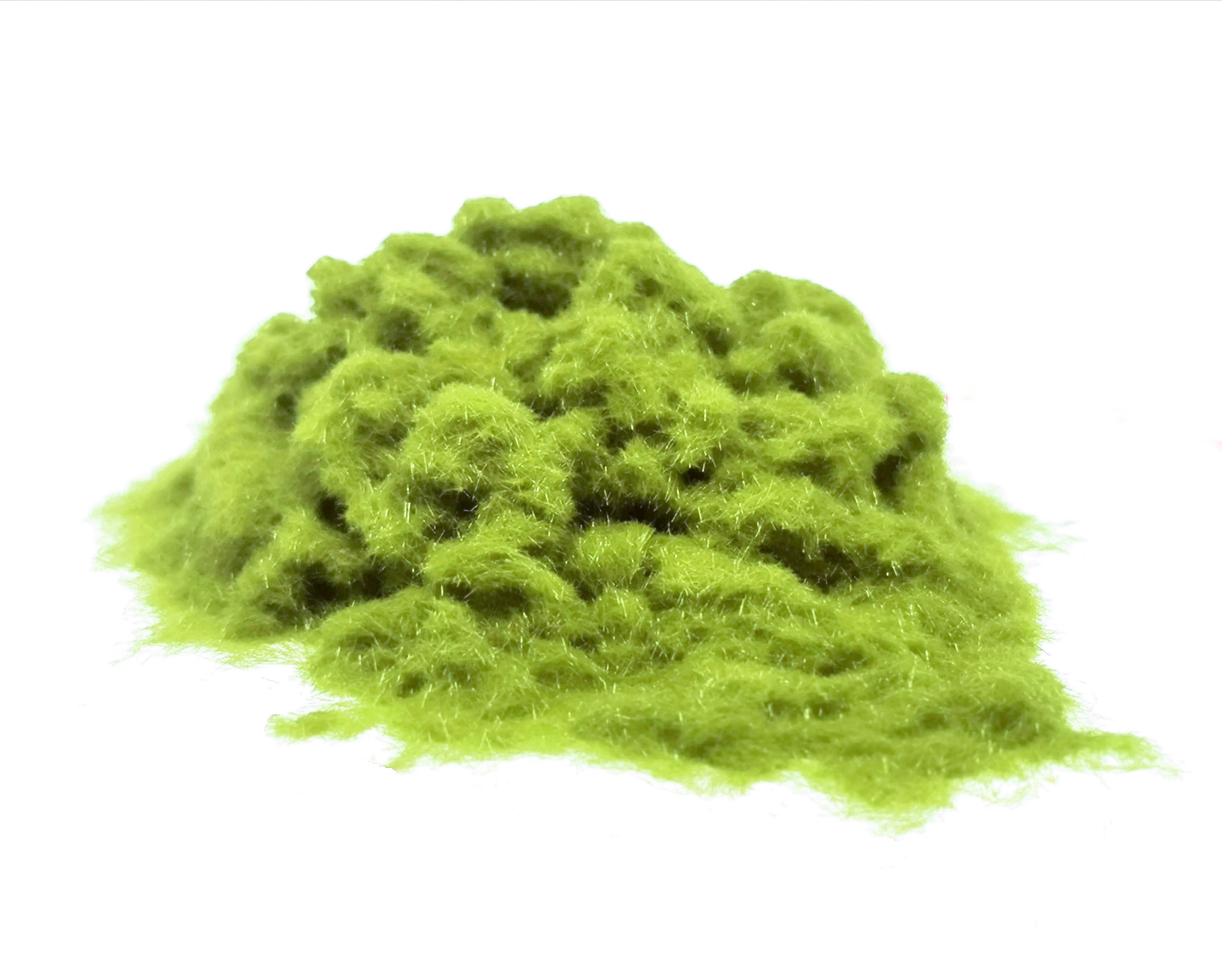 Close-up of a soft, textured pile of Pistachio Green 1mm nylon flock fibres, used for DIY flocking projects.